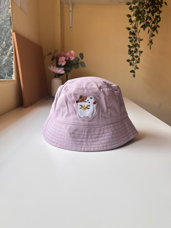 Cate holding star bucket hat